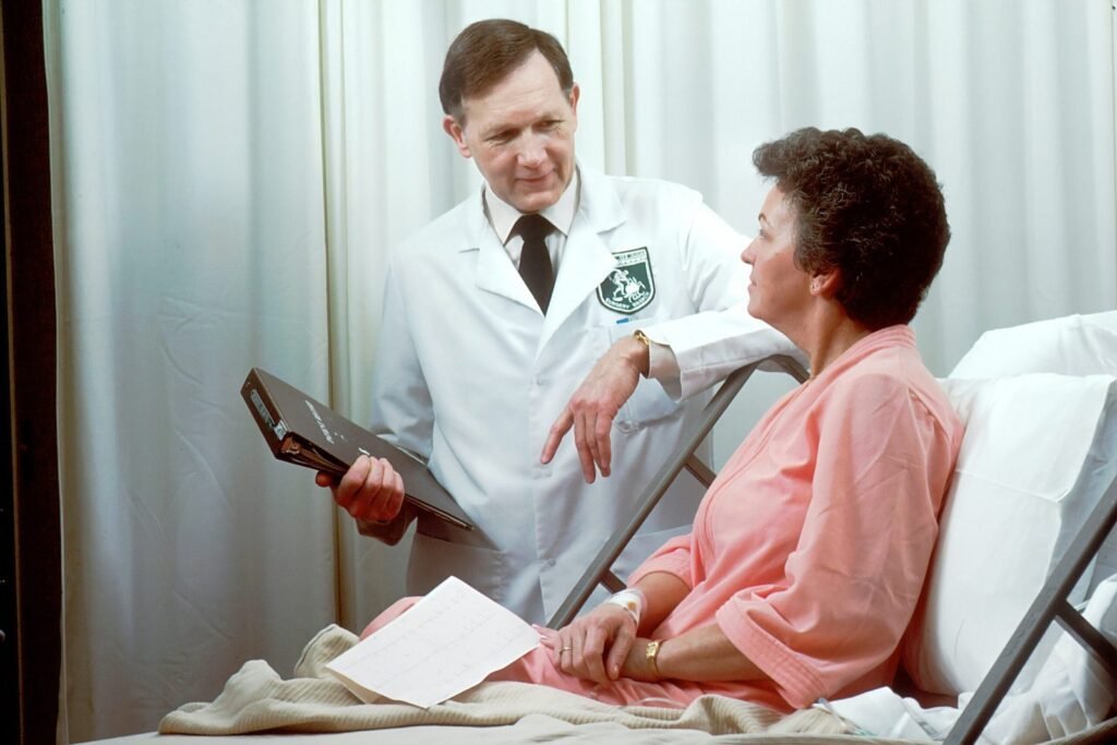 man in white button up shirt holding ,Coat Technique for Health Care Professionals black tablet computer